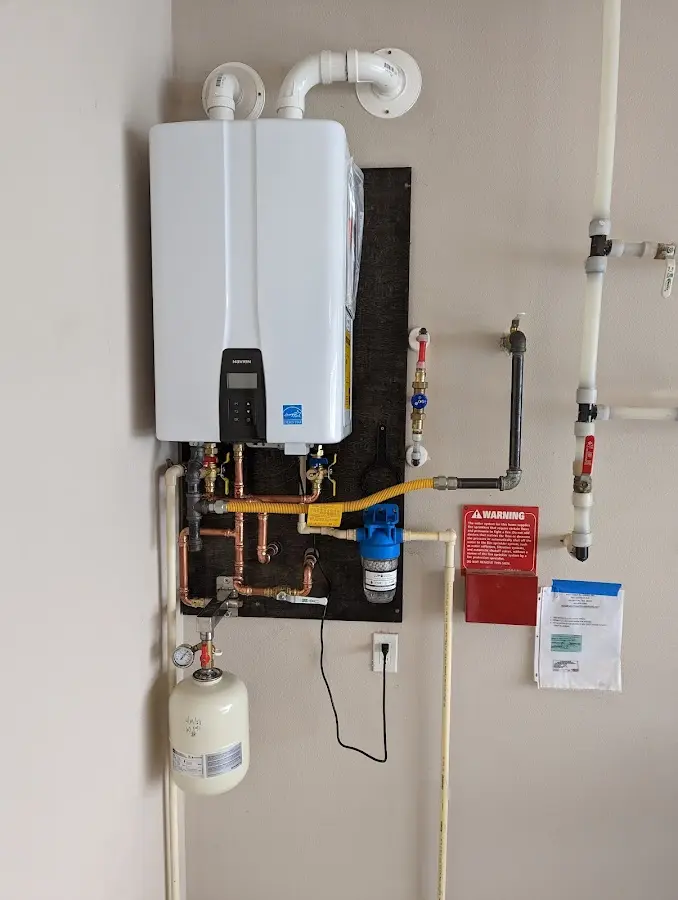 Professional plumber installing copper piping in a Lakeside home